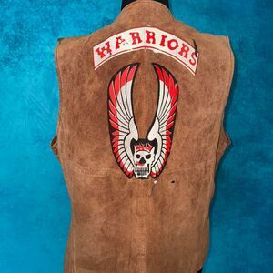 Brown leather biker vest with wings and skull on back